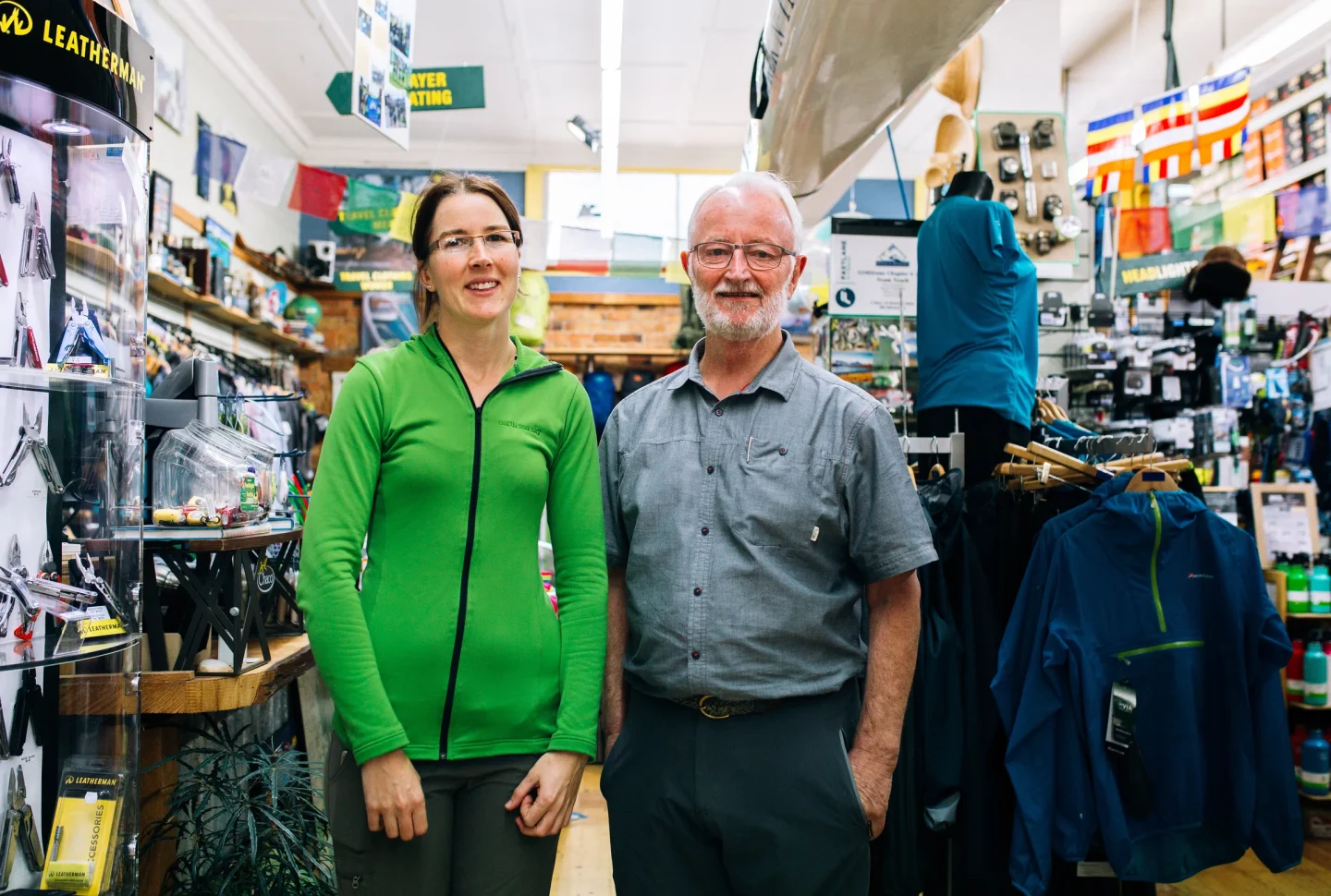 Two local business owners in their outdoor equipment shop in Hamilton Central.